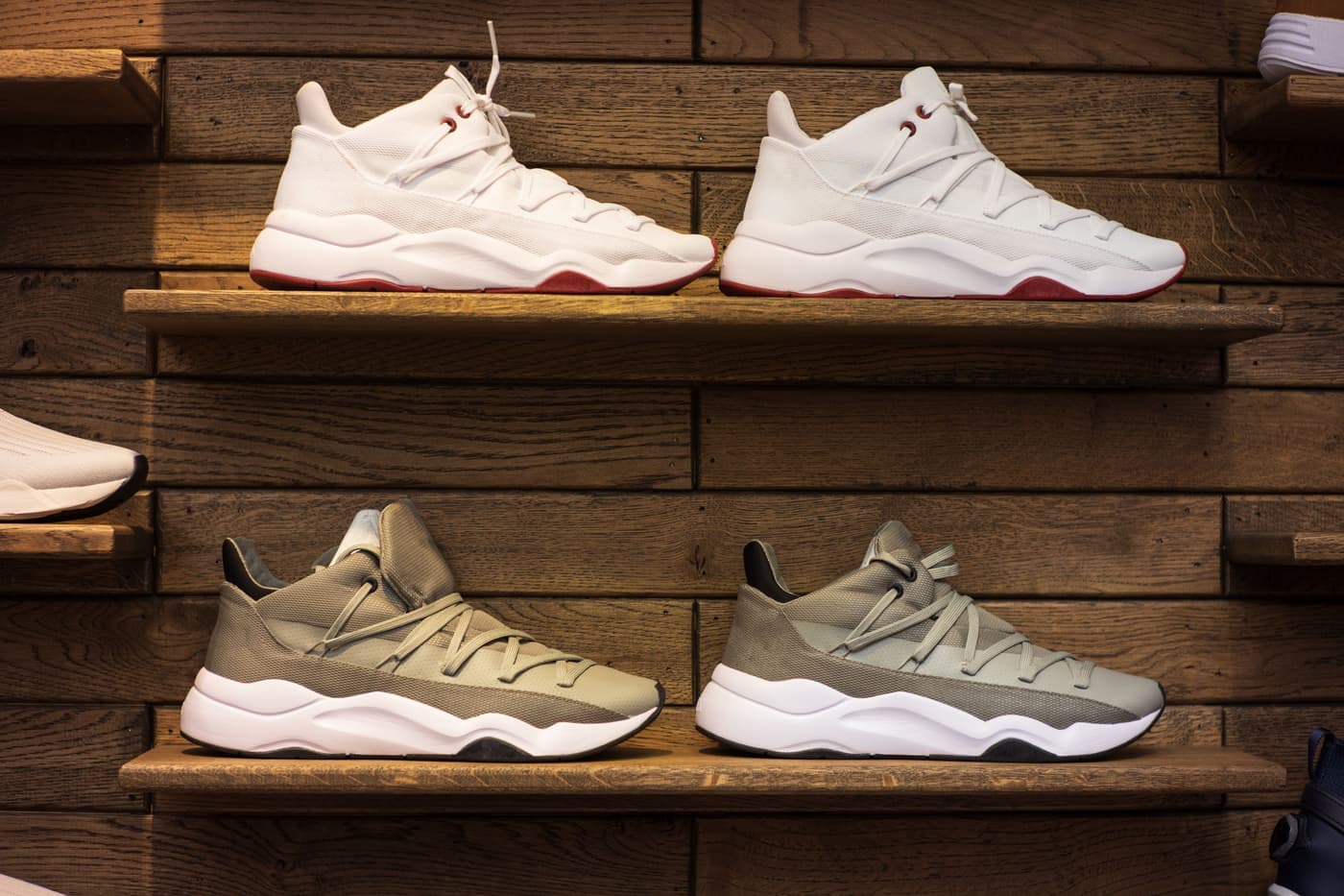 Sneakers displayed on wooden shelves