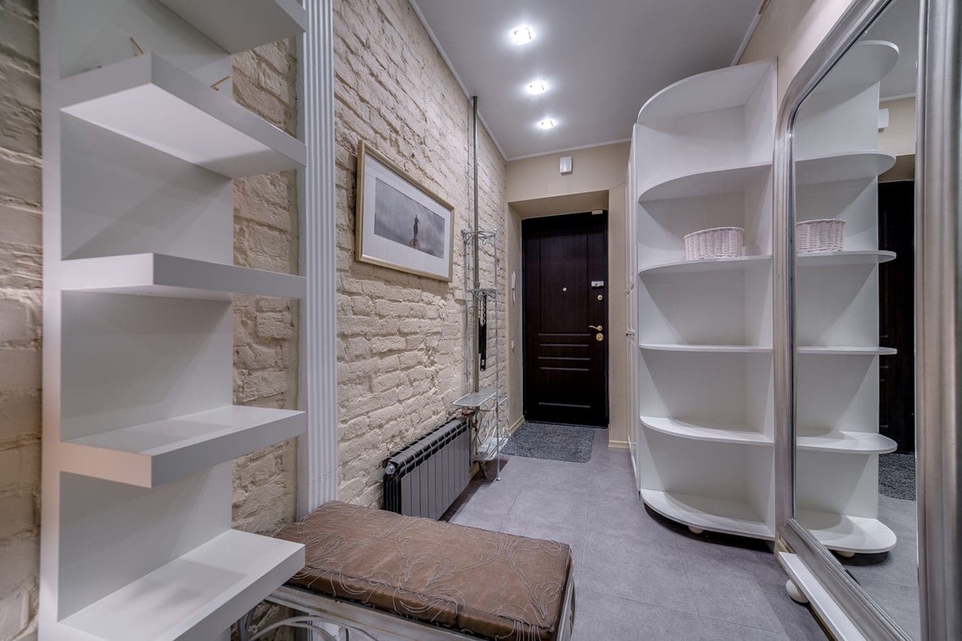 Storage furniture arranged along a long hallway wall