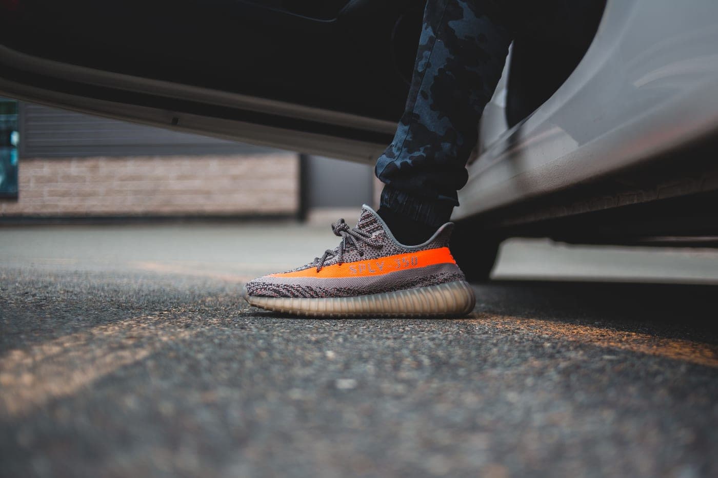 Sneakers airing out beside an open door